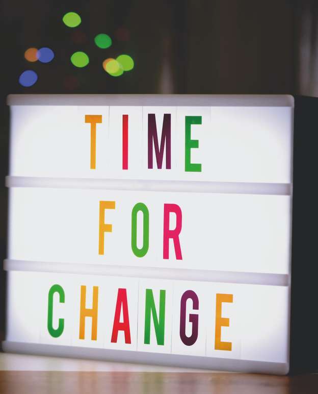 Illuminated sign reading Time for Change